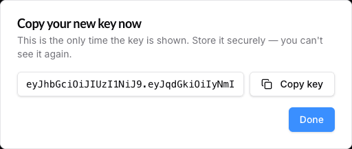Key reveal dialog after creation showing the one-time read-only key textbox and Copy key button